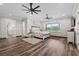 Serene main bedroom showcasing hardwood floors, natural light, and a cozy atmosphere, perfect for relaxation and rest at 11657 Moore Rd, Lakeland, FL 33809