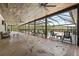 Spacious covered patio with plenty of seating, offering an ideal spot for outdoor relaxation and entertaining at 11657 Moore Rd, Lakeland, FL 33809