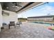 Backyard featuring a luxurious in-ground pool, covered patio, and spacious seating area at 11657 Moore Rd, Lakeland, FL 33809