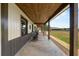 The house features a long porch with rocking chairs, offering a comfortable outdoor space at 11657 Moore Rd, Lakeland, FL 33809