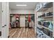 Organized walk-in closet with custom shelving offers ample storage space for clothing, shoes, and accessories in style at 11657 Moore Rd, Lakeland, FL 33809
