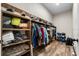 Spacious walk-in closet with custom wood shelving for clothing and accessories at 11657 Moore Rd, Lakeland, FL 33809