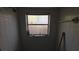 Small tiled shower room with a frosted window at 20045 Sw 88Th Place Rd, Dunnellon, FL 34431