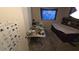 Cluttered bedroom featuring a bed, side table, and a small window at 20045 Sw 88Th Place Rd, Dunnellon, FL 34431
