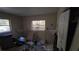 Bedroom featuring two windows, closet, and carpet flooring at 20045 Sw 88Th Place Rd, Dunnellon, FL 34431