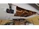 Garage ceiling showing damage and garage door opening mechanism at 20045 Sw 88Th Place Rd, Dunnellon, FL 34431