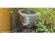 Outdoor HVAC unit surrounded by greenery and vegetation at 20045 Sw 88Th Place Rd, Dunnellon, FL 34431