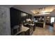Spacious kitchen with sleek black cabinets and modern appliances at 20045 Sw 88Th Place Rd, Dunnellon, FL 34431
