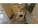Laundry room with washing machine, peeling wallpaper, and unfinished floors at 20045 Sw 88Th Place Rd, Dunnellon, FL 34431
