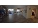 Open living room with wood floors throughout leading to multiple rooms at 20045 Sw 88Th Place Rd, Dunnellon, FL 34431
