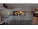 View from Living Room into kitchen area with serving bar at 20045 Sw 88Th Place Rd, Dunnellon, FL 34431