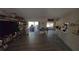 Open-concept living room with hardwood floors and sliding glass doors to the patio at 20045 Sw 88Th Place Rd, Dunnellon, FL 34431