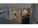 Open living room with wood floors throughout leading to multiple rooms at 20045 Sw 88Th Place Rd, Dunnellon, FL 34431