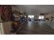 Bright living room showcasing hardwood floors and sliding glass doors to the patio at 20045 Sw 88Th Place Rd, Dunnellon, FL 34431