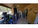 Enclosed porch needing clean up and showing ceiling fan at 20045 Sw 88Th Place Rd, Dunnellon, FL 34431