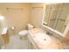 Bathroom with marble vanity countertop, sink, and mirrored cabinet at 2521 Tamarind Dr, Edgewater, FL 32141