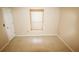 Bedroom features tile flooring and a window with a bamboo blind at 2521 Tamarind Dr, Edgewater, FL 32141