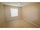Bedroom featuring tile floors, neutral walls, and a window at 2521 Tamarind Dr, Edgewater, FL 32141