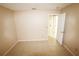 Bedroom features neutral walls, tile flooring, and an open door at 2521 Tamarind Dr, Edgewater, FL 32141