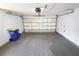 Clean and spacious two car garage, featuring a garage door and utility connections at 2521 Tamarind Dr, Edgewater, FL 32141