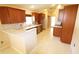 Functional kitchen features wood cabinets, countertops, and tile flooring, with a view of the backyard at 2521 Tamarind Dr, Edgewater, FL 32141