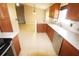 Well-equipped kitchen featuring wood cabinets, tile backsplash, and stainless steel appliances at 2521 Tamarind Dr, Edgewater, FL 32141