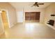 Bright, neutrally painted living room showcasing tile flooring, a ceiling fan, and window with natural light at 2521 Tamarind Dr, Edgewater, FL 32141
