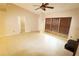 Open living room features tile flooring, a ceiling fan, and access to other rooms in the home at 2521 Tamarind Dr, Edgewater, FL 32141