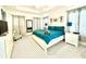 Bright bedroom with vaulted ceilings, featuring a queen bed and modern nautical decor at 4500 Monado Dr, Kissimmee, FL 34746