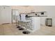 Well-equipped kitchen with white cabinets, stainless steel appliances, and counter seating at 4500 Monado Dr, Kissimmee, FL 34746