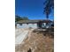 Rear exterior of home with a yard and patio at 605 Maggie Cir, Winter Haven, FL 33880