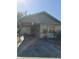 View of the home's front with an attached carport at 605 Maggie Cir, Winter Haven, FL 33880