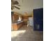 The kitchen features light wood cabinets and appliances at 605 Maggie Cir, Winter Haven, FL 33880