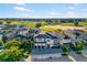Gorgeous aerial view of a luxury home near a golf course in a beautiful neighborhood at 1514 Corolla Ct, Reunion, FL 34747