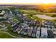 Picturesque aerial view showcasing the homes alongside the lush golf course and scenic views at 1514 Corolla Ct, Reunion, FL 34747