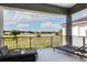 Relaxing balcony view overlooking a pristine golf course, offering serene outdoor living and stunning scenery at 1514 Corolla Ct, Reunion, FL 34747