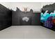 Private indoor basketball court with custom Orlando Magic wall mural at 1514 Corolla Ct, Reunion, FL 34747