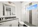 Stylish bathroom with a modern vanity, walk-in shower, and decorative tile accents at 1514 Corolla Ct, Reunion, FL 34747