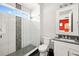 Contemporary bathroom with a glass shower, decorative tile, and a modern vanity at 1514 Corolla Ct, Reunion, FL 34747