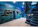 Unique bedroom with ocean themed decor and custom bunk beds and blue walls at 1514 Corolla Ct, Reunion, FL 34747