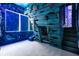 A unique bedroom with a custom-built shipwreck-themed bed, slide, and underwater decor at 1514 Corolla Ct, Reunion, FL 34747