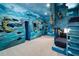 Nautical themed bedroom with custom shipwreck themed built-in bunk beds and mural at 1514 Corolla Ct, Reunion, FL 34747