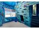 Nautical themed bedroom with custom shipwreck themed built-in bed, undersea mural and slide at 1514 Corolla Ct, Reunion, FL 34747
