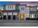 Stunning two-story home with modern design, three-car garage, and beautifully landscaped front yard at 1514 Corolla Ct, Reunion, FL 34747