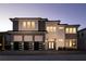 Beautiful two-story home featuring a three-car garage, modern design, and inviting front entrance with sidelights at 1514 Corolla Ct, Reunion, FL 34747