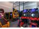 Fun game room equipped with a variety of arcade games, offering endless entertainment for all ages at 1514 Corolla Ct, Reunion, FL 34747