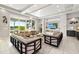 Bright living room with access to the outdoor patio and pool area at 1514 Corolla Ct, Reunion, FL 34747