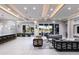 Expansive living room with modern furniture, recessed lighting, a bar area, and sliding glass doors to the outside at 1514 Corolla Ct, Reunion, FL 34747