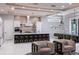 Open-concept living room with a kitchen island, dining table, recessed lighting, and modern decor at 1514 Corolla Ct, Reunion, FL 34747