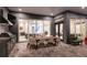 Spacious outdoor living area featuring a grill, a dining area, and a comfortable seating space at 1514 Corolla Ct, Reunion, FL 34747